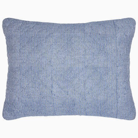 A Nandi Indigo Quilt pillow with simple stripes by John Robshaw.