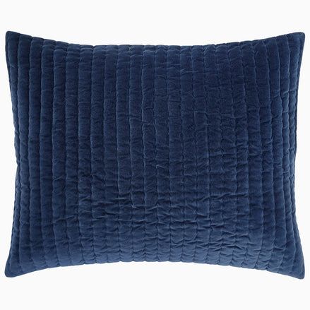 A Velvet Indigo Quilt hand quilted by Indian artisans on a white background by John Robshaw.