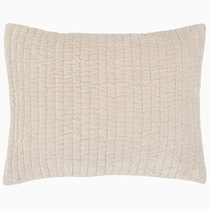 A soft beige Velvet Sand Quilt pillow on a white background, hand quilted by John Robshaw.