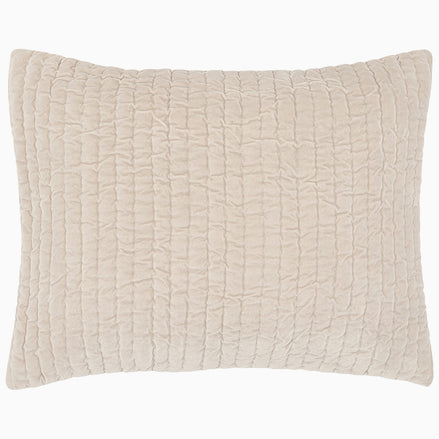 A soft beige Velvet Sand Quilt pillow on a white background, hand quilted by John Robshaw.