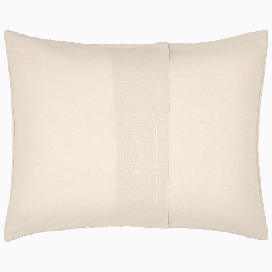 A Velvet Sand Quilt pillow on a soft white background, by John Robshaw.