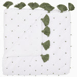 A French Knot Dark Sage Throw with green tassels on it by John Robshaw. - 30395672035374
