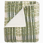 The Jatin Sage Throw by John Robshaw features a green and white plaid front with a solid white back, shown folded with one corner flipped to reveal the underside.