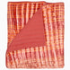 The Jatin Terracotta Throw by John Robshaw features a patterned velvet texture in pink, orange, and gold with a solid pink back, shown on a plain background.