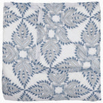 Folded John Robshaw's Dasati Lapis Quilt, featuring a blue and gray geometric leaf pattern, crafted from cotton voile.