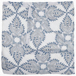 Folded John Robshaw's Dasati Lapis Quilt, featuring a blue and gray geometric leaf pattern on a white background, crafted from cotton voile. - 31272423424046