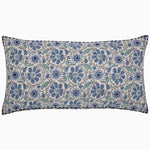 The Yavi Azure Bolster by John Robshaw is a rectangular pillow featuring a floral pattern in shades of blue and green on a white background, enhanced by hand-stitched edging. - 31272676491310