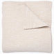 A Vivada Sand Woven Quilt, hand-stitched quilt, on a white background by John Robshaw.