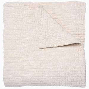 A Vivada Sand Woven Quilt, hand-stitched quilt, on a white background by John Robshaw.