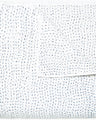 A white Organic Hand Stitched Light Indigo Quilt with blue dots on it, made with hand stitching and cotton voile, by John Robshaw.
