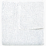 A white Organic Hand Stitched Light Indigo Quilt with blue dots on it, made with hand stitching and cotton voile, by John Robshaw. - 28007109230638