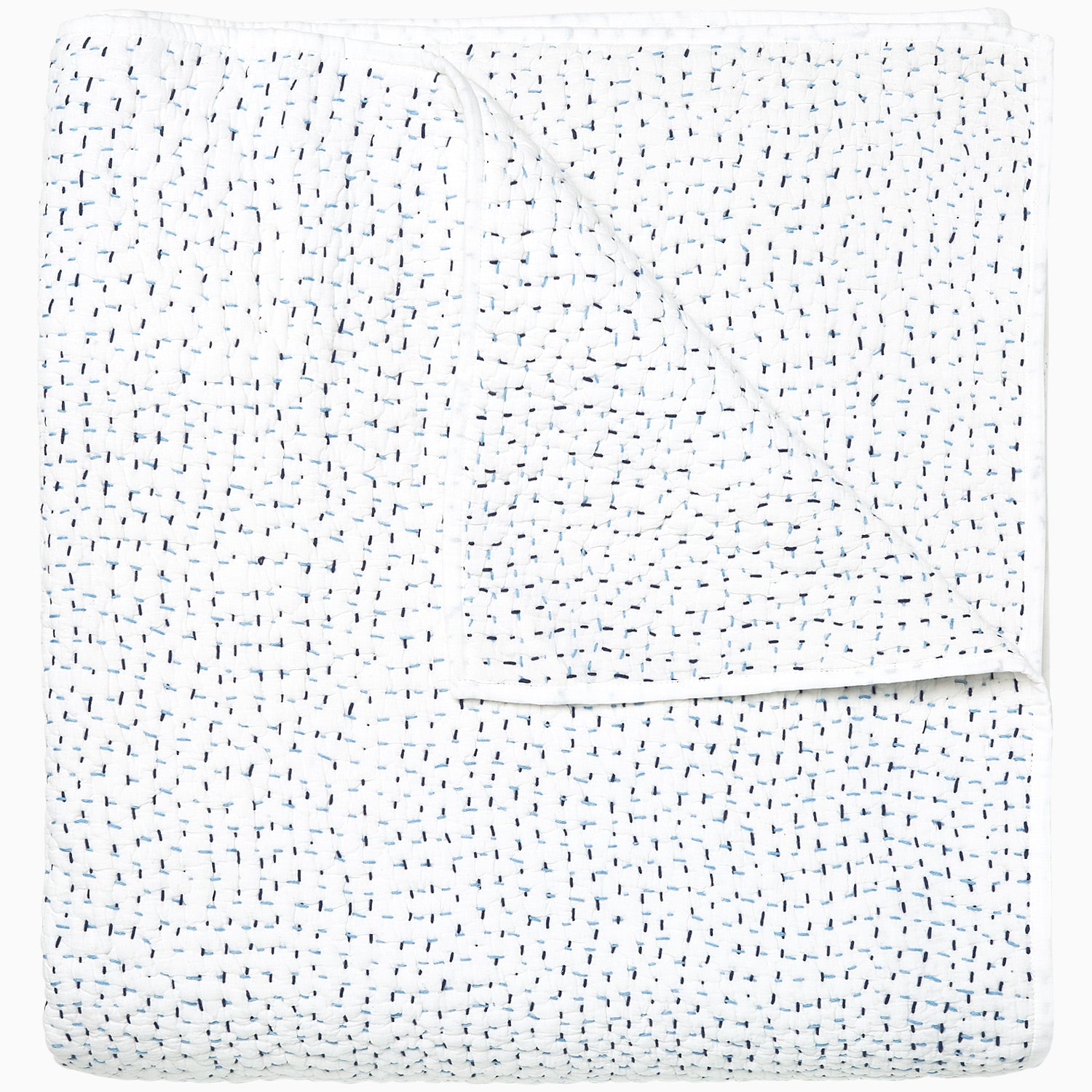 A white Organic Hand Stitched Light Indigo Quilt with blue dots on it, made with hand stitching and cotton voile, by John Robshaw.