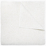 A white cotton voile coverlet featuring John Robshaw's Organic Hand Stitched Sand Quilt with subtle white dot patterns. - 28007111360558