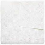 A white cotton voile coverlet featuring John Robshaw's Organic Hand Stitched Sand Quilt with subtle white dot patterns.