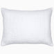 A Vivada White Woven Quilt pillow with hand stitching on a white background by John Robshaw.
