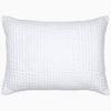 A Vivada White Woven Quilt pillow with hand stitching by John Robshaw.