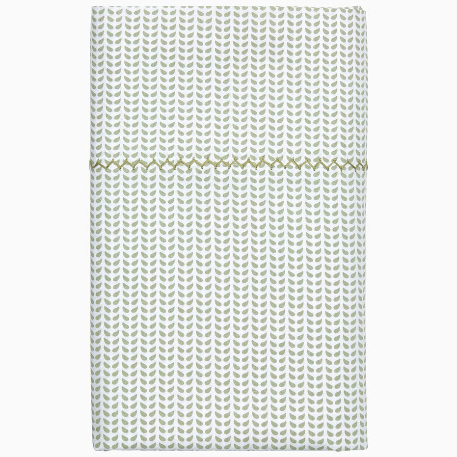 A Cinde Sage Organic Sheet Set made from 100% cotton percale, featuring a white and gold chevron pattern, by John Robshaw.