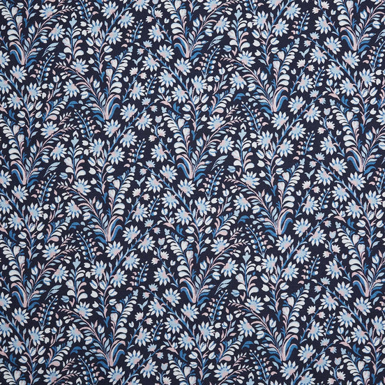 A Valli Indigo Fabric by John Robshaw, a blue and white floral printed fabric known for its handmade quality.