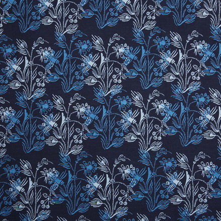 An Ananya Indigo fabric, hand-printed with blue and white floral design, by John Robshaw.
