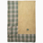 A yellow and green checkered Why an Orange Stripe? Ralli Blanket on a white background, handmade in India by John Robshaw. - 29483534811182