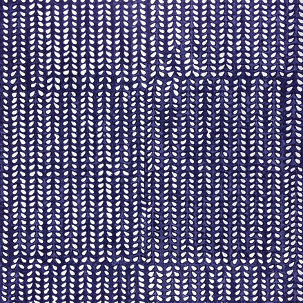 an Aleppo Indigo Wallpaper by John Robshaw with a blue and white pattern