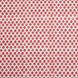 A red and white pattern on a white background, featuring traditional craftsmanship, with the Bindi Coral Fabric by John Robshaw.