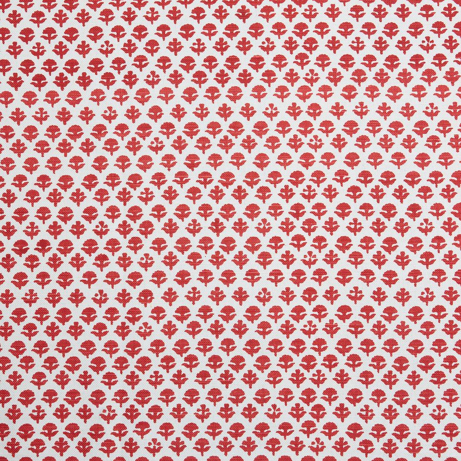 A red and white pattern on a white background, featuring traditional craftsmanship, with the Bindi Coral Fabric by John Robshaw.