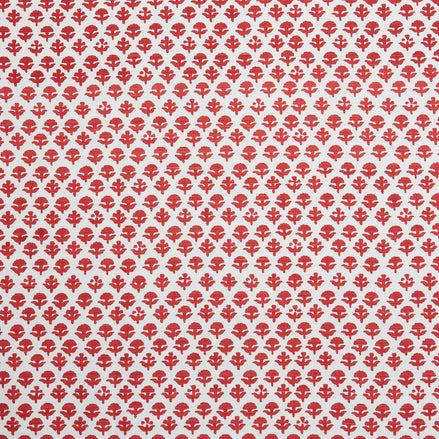 A red and white pattern, featuring traditional craftsmanship, with the Bindi Coral Fabric by John Robshaw.