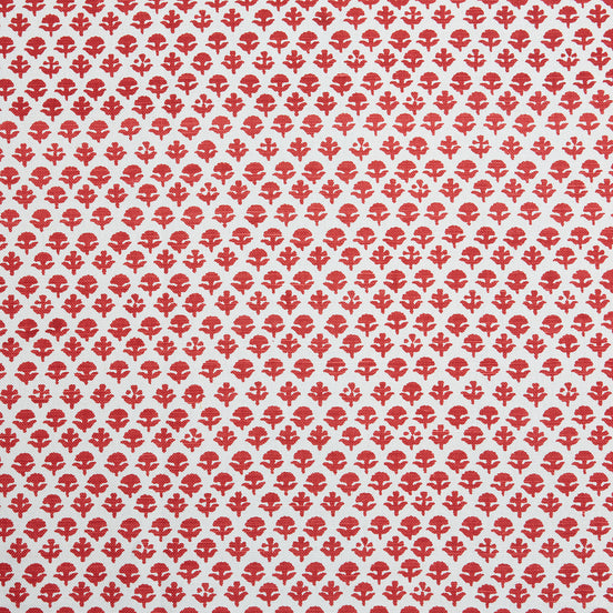 A red and white pattern on a white background, featuring traditional craftsmanship, with the Bindi Coral Fabric by John Robshaw.
