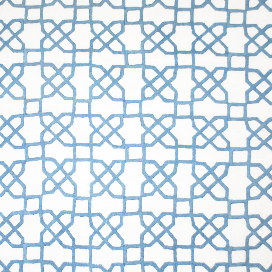 A blue and white pattern adorned with Mughal motifs on a white background, expertly crafted using traditional techniques of hand block printing, featuring the Citadel Light Indigo Fabric by John Robshaw.
