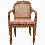 An ornate Bone Inlay Cane Chair by John Robshaw with a pink upholstered seat and Indian hard wood frame. - 29413896192046