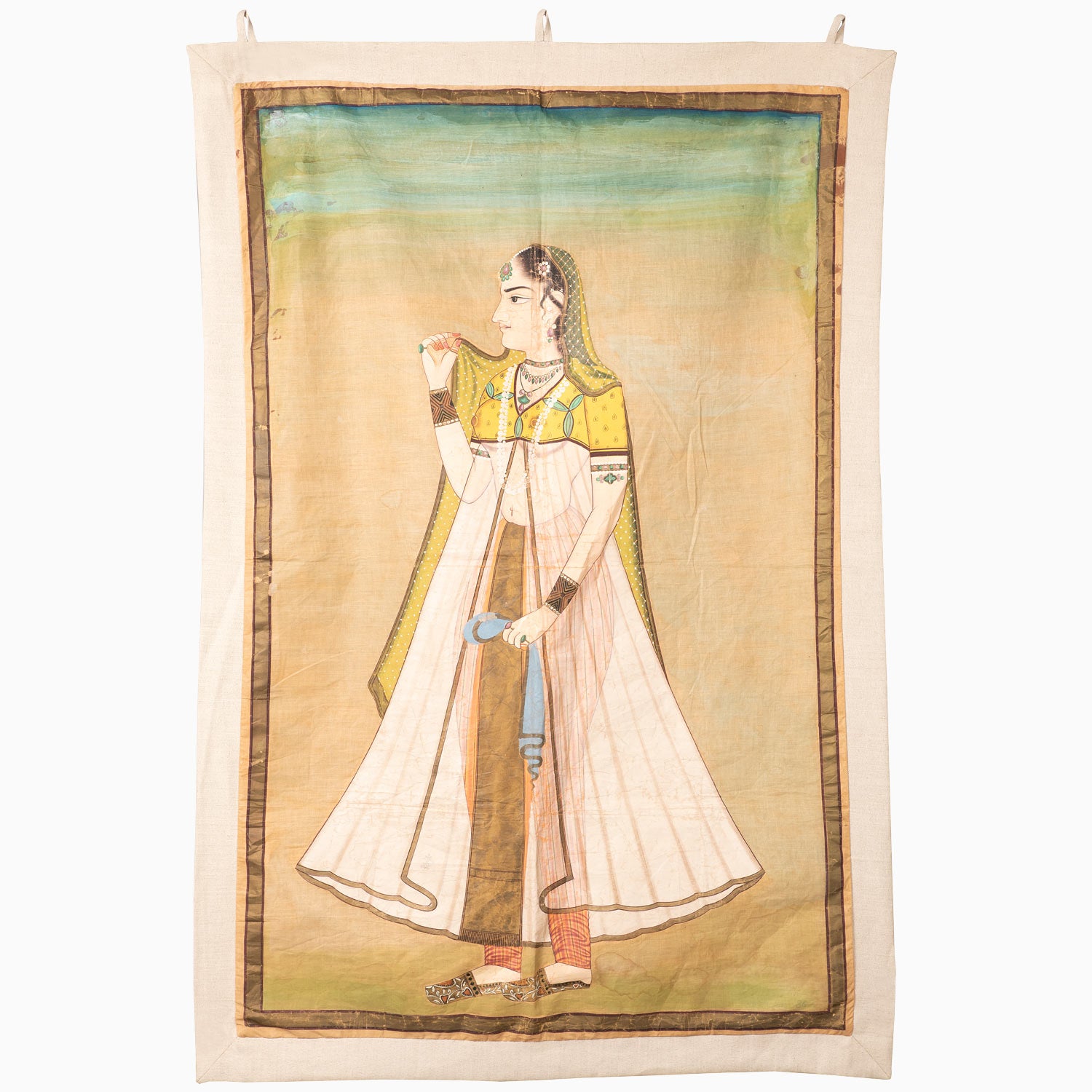 A Princess With Faded Blue Sky Tapestry, hand-painted by John Robshaw, of a woman holding a pipe, acquired while traveling in India.