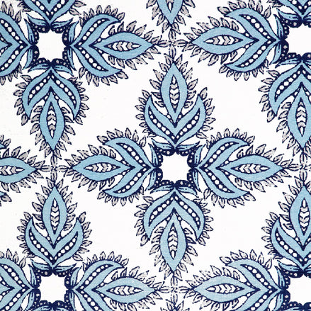 A Diba Light Indigo Fabric by John Robshaw, hand block printed with a blue and white paisley pattern, featuring the protective symbol of nazar.