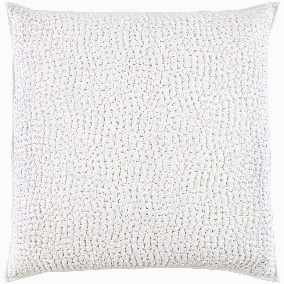 A white pillow with an Organic Hand Stitched Sand Quilt cover embellished with hand stitched beads by John Robshaw.