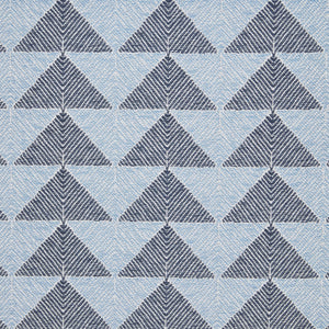 A Farzu Azure Performance Fabric rug with blue and white triangles on it by John Robshaw.