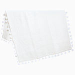 A Sahati White Throw blanket with tassels on it by John Robshaw. - 28455930593326