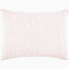 A John Robshaw Organic Hand Stitched Lotus Quilt with a pink and white pillow with dots on an organic cotton voile coverlet.