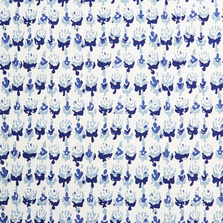 A blue and white wax print pattern on a Kiki Turquoise Fabric hand block printed by John Robshaw.