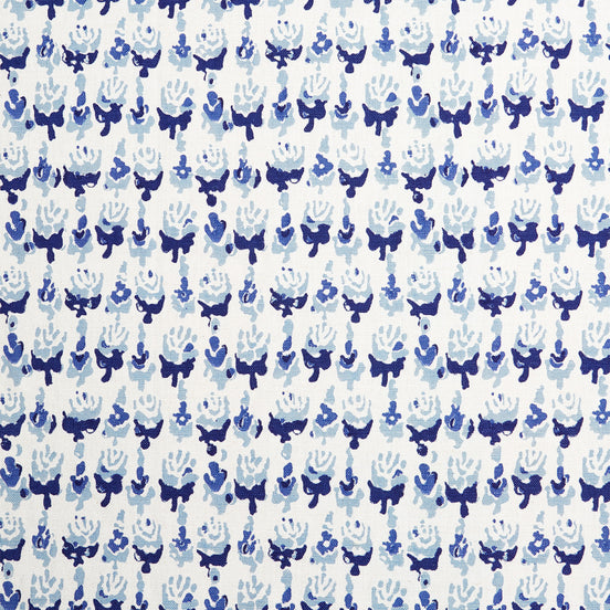 A blue and white wax print pattern on a Kiki Turquoise Fabric hand block printed by John Robshaw.