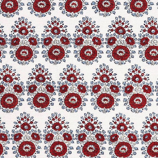 A hand block printed Lanka Coral Fabric with a red and blue paisley pattern on a white background, showcasing traditional craftsmanship, from the brand John Robshaw.