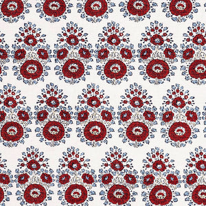 A hand block printed Lanka Coral Fabric with a red and blue paisley pattern, showcasing traditional craftsmanship, from the brand John Robshaw.