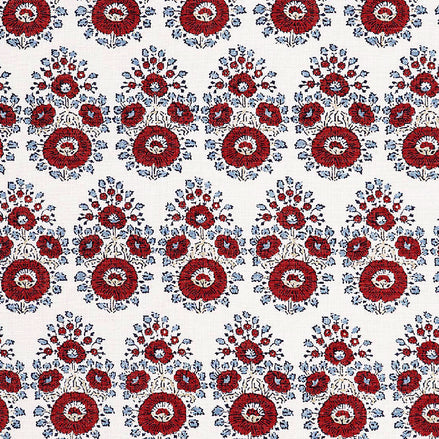 A hand block printed Lanka Coral Fabric with a red and blue paisley pattern, showcasing traditional craftsmanship, from the brand John Robshaw.