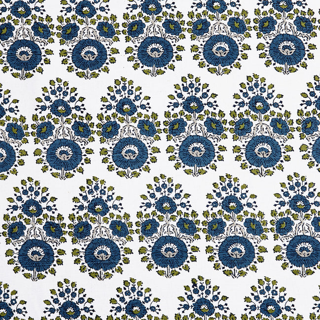 A blue and green floral pattern on a white background featuring traditional craftsmanship of the Lanka Peacock Fabric by John Robshaw.