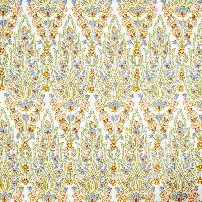 A blue and yellow paisley pattern inspired by Mughal gardens, hand block printed on a white background with traditional craftsmanship, the Marmar Seaglass Fabric by John Robshaw.