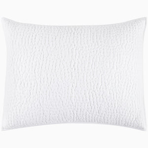 An Organic Hand Stitched White Quilt from John Robshaw with a cotton voile coverlet on a white background.