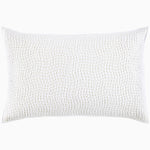A white pillow with hand stitching and organic cotton voile coverlets, featuring the Organic Hand Stitched Sand Quilt by John Robshaw.