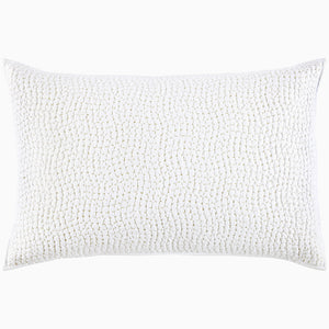 A white pillow with hand stitching and organic cotton voile coverlets, featuring the Organic Hand Stitched Sand Quilt by John Robshaw.