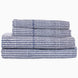 A stack of 200 Cinde Indigo Organic Sheet Set by John Robshaw, indigo and white patterned sheets.