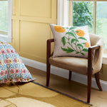 A Sunny Marigold Decorative Pillow by John Robshaw is placed next to a window. - 30065940365358