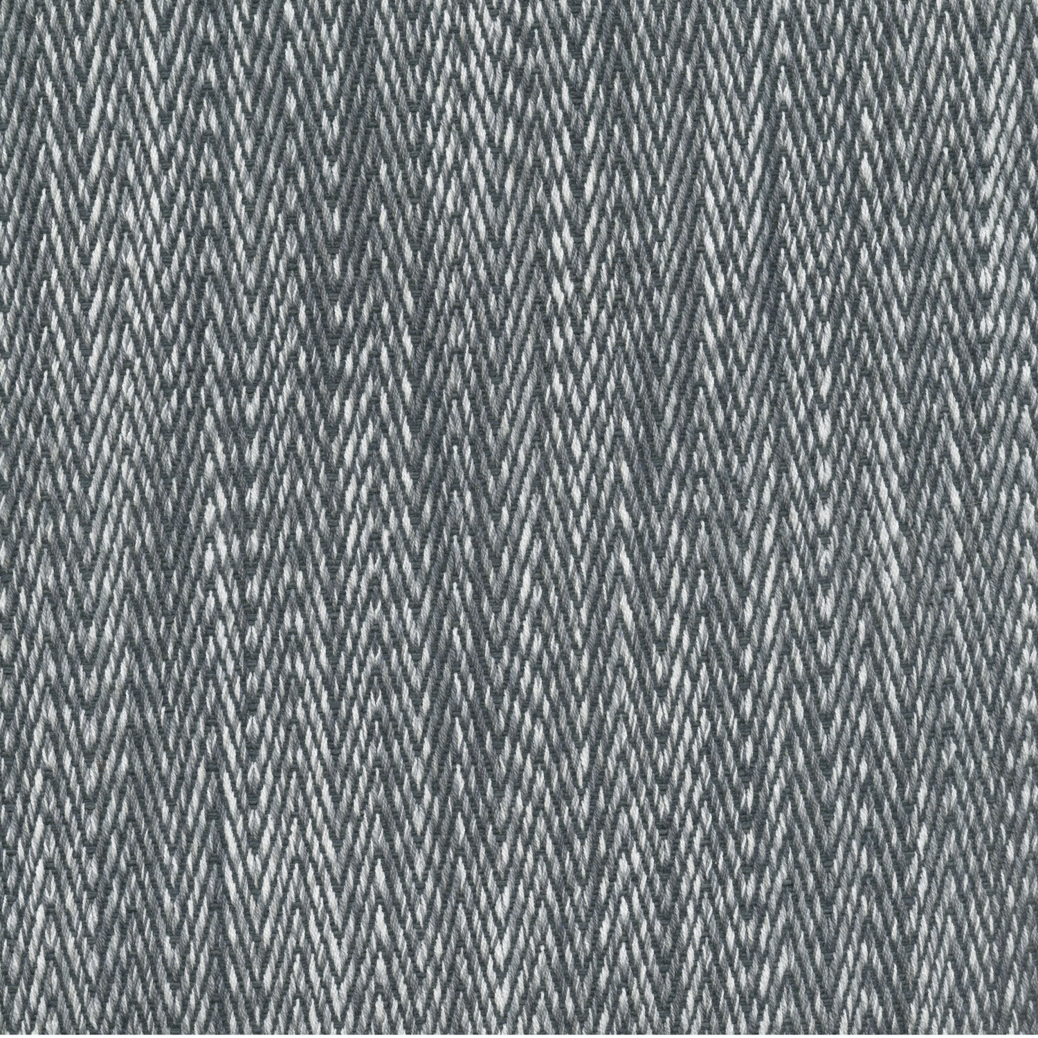 A Tapasa Gray Fabric rug with a zig zag pattern by John Robshaw.